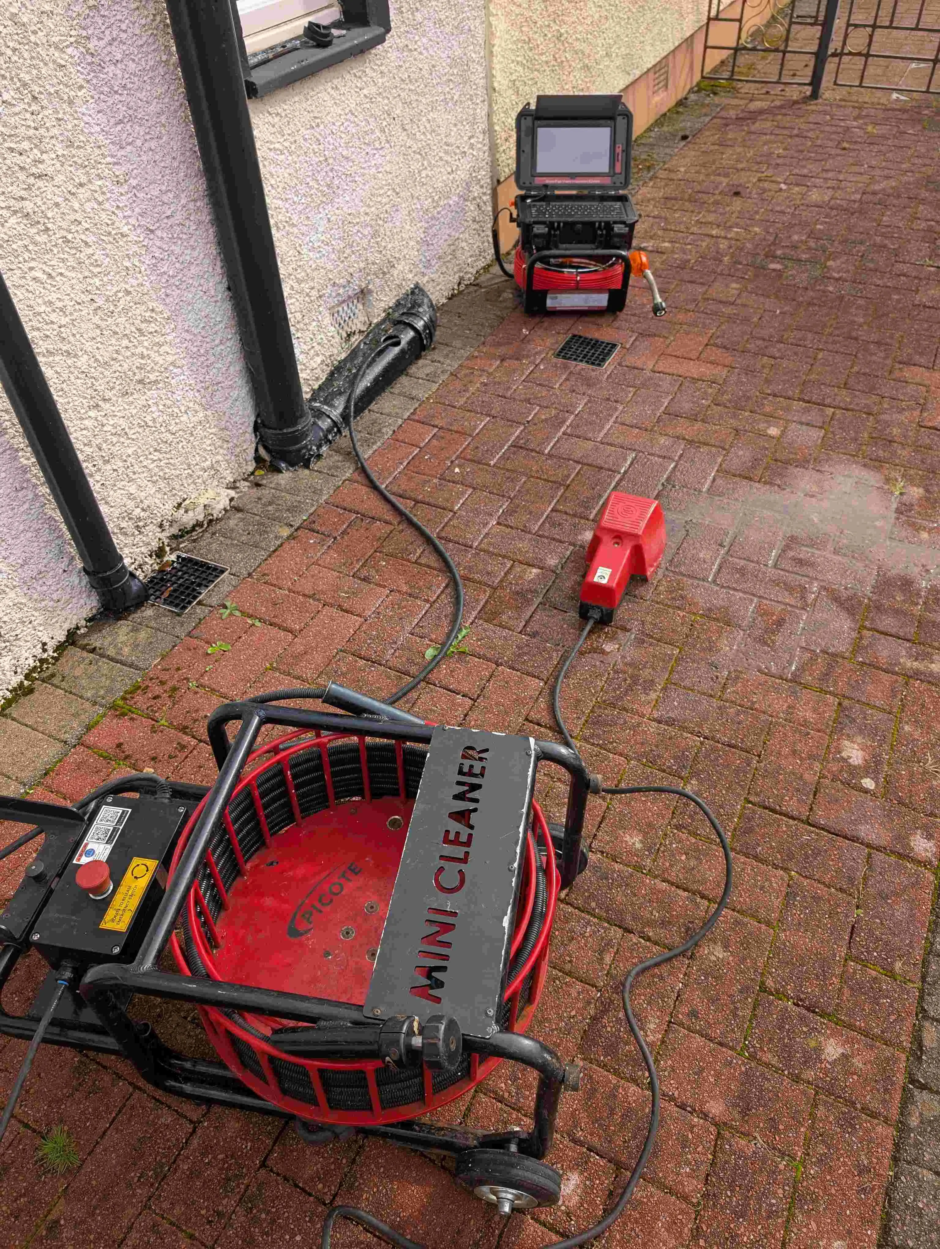 Drain specialist working on a drain