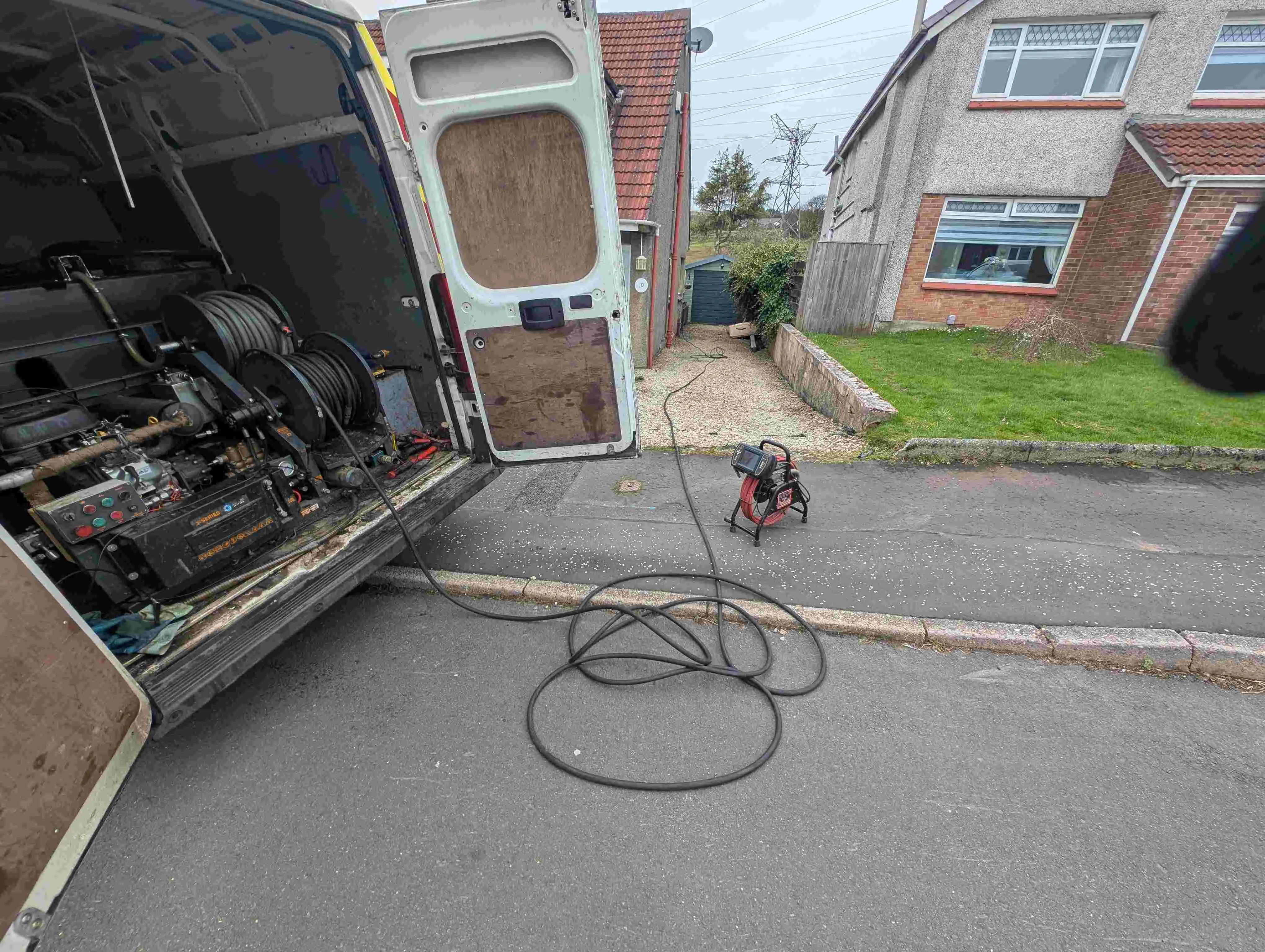 Drain specialist working on a drain